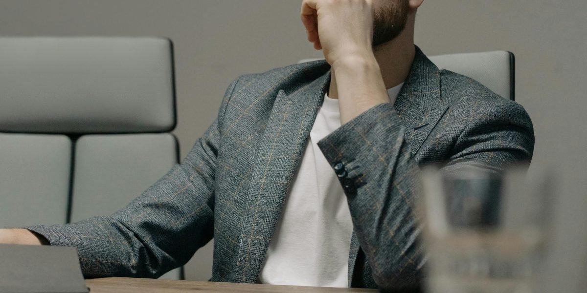 A business leader deep in thought, processing a deluge of information to make strategic decisions.