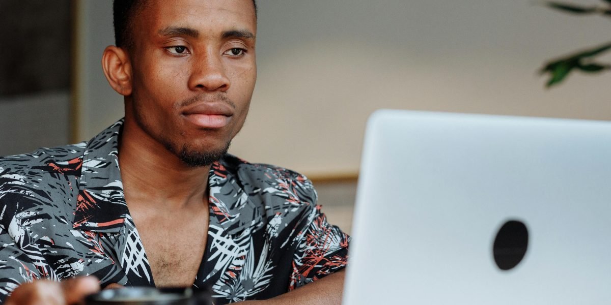 A person working productively from a cafe, representing the widespread adoption of remote work.