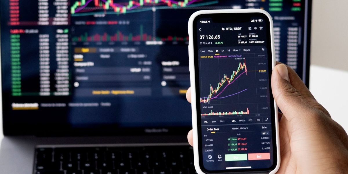 A person focused on financial charts and data, representing the careful analysis investors undertake in the AI market.
