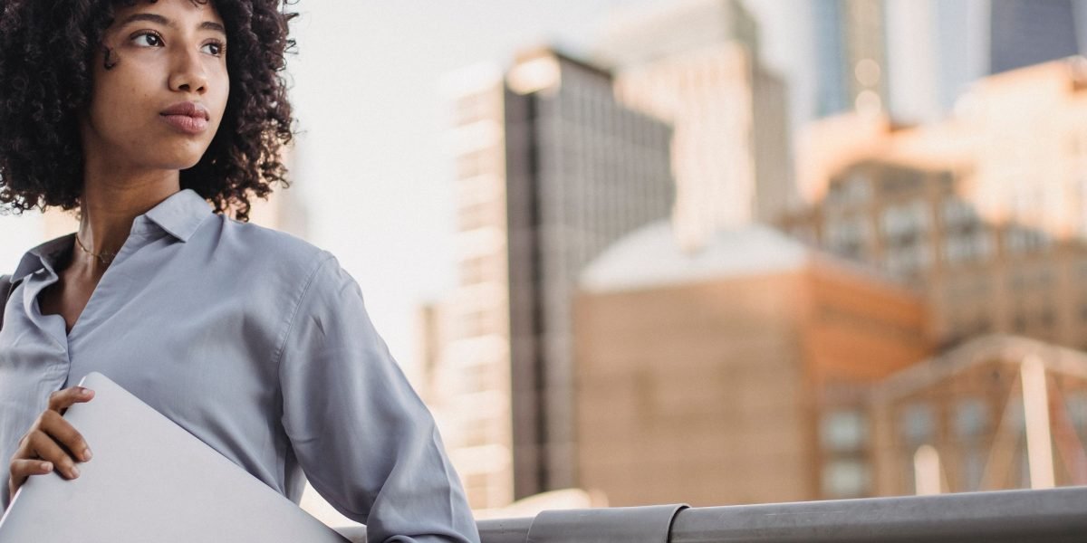 A person looking confidently towards a dynamic future, symbolizing the new frontier of fintech.