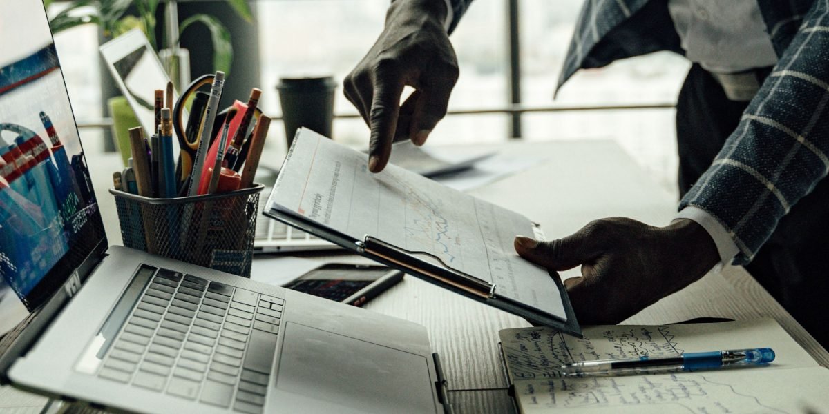 Professionals analyzing data and charts, making strategic decisions based on market signals.