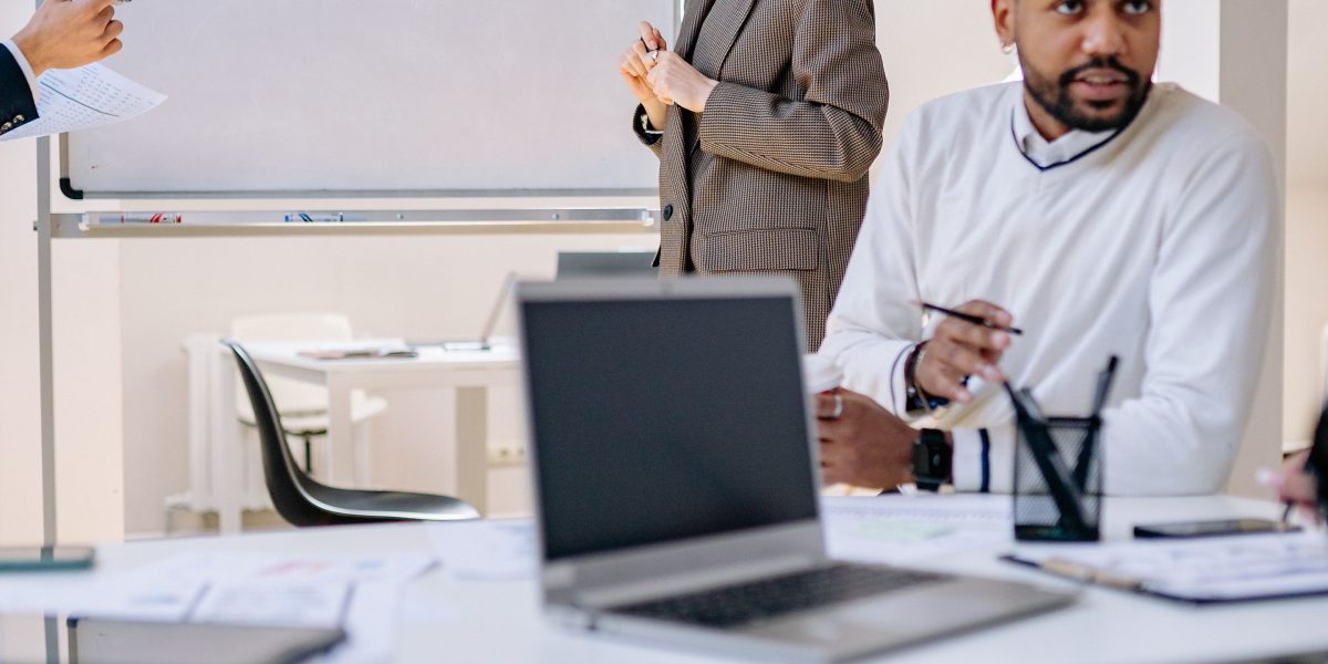 A diverse team actively collaborating, symbolizing the implementation of an organizational AI literacy framework.