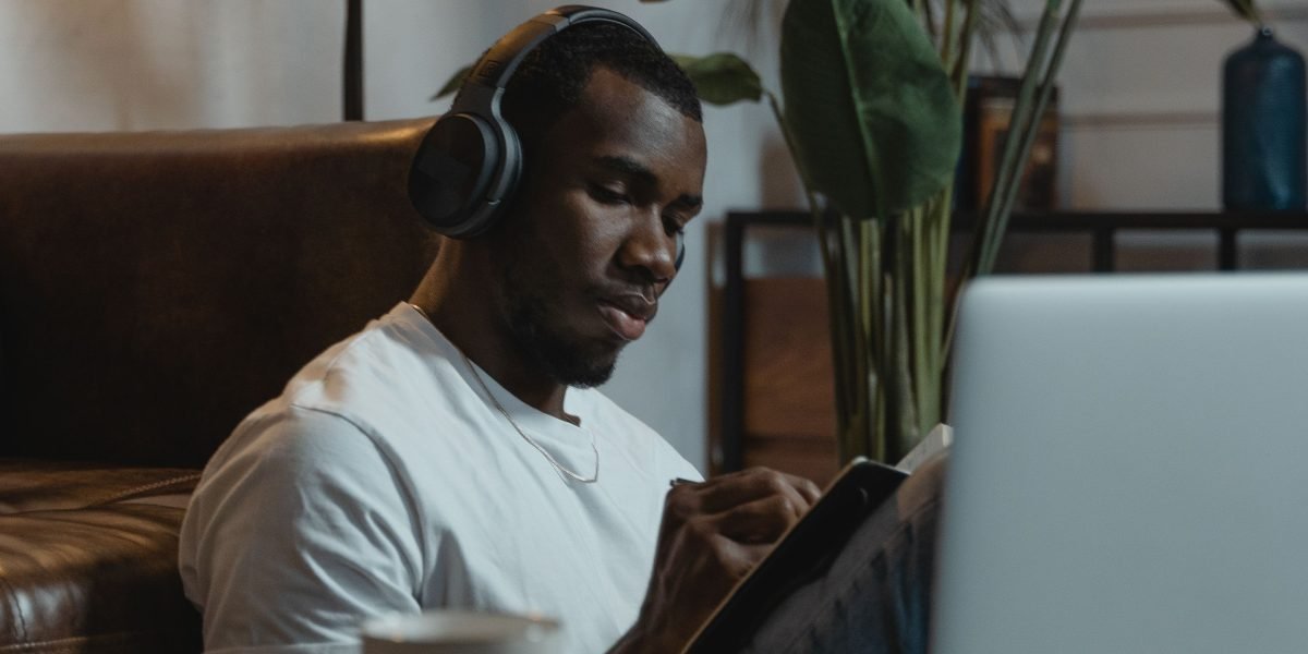 A person focused on online learning, symbolizing the actionable steps to boost AI literacy through structured courses.