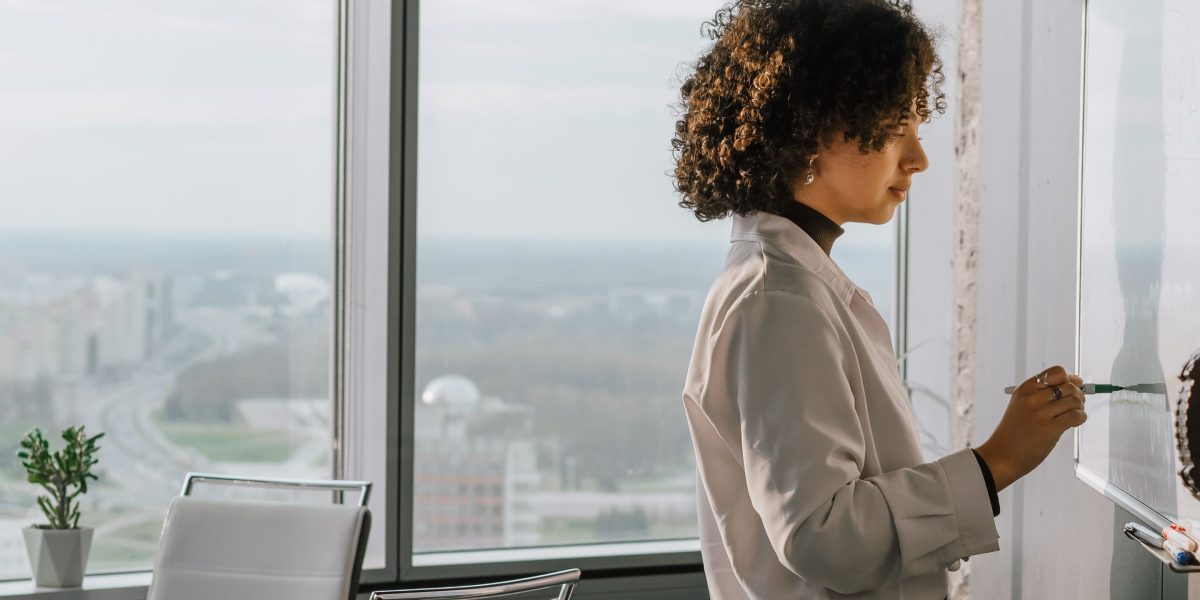 A person intently focusing, symbolizing the deep thought required to identify core problems that AI can solve for a successful startup.