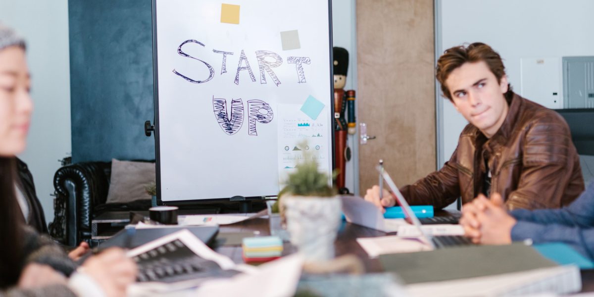 A confident entrepreneur presenting their vision AI startup to a group of potential investors, seeking funding for growth.