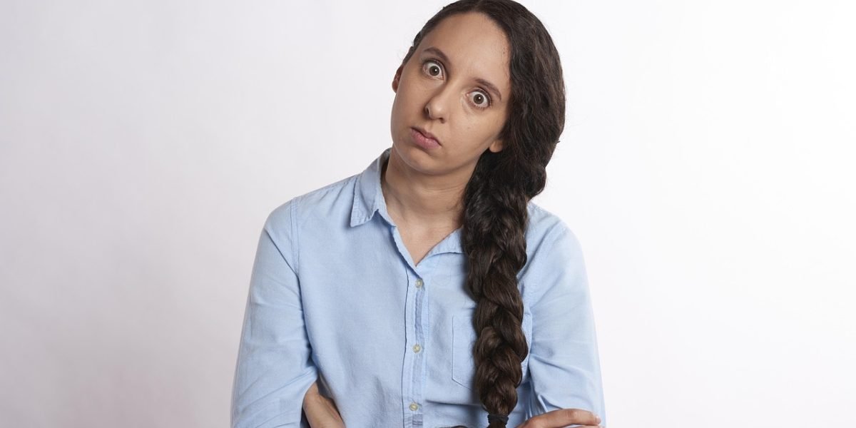 An investor reacts with frustration after missing a significant stock move due to being unaware of market hours.