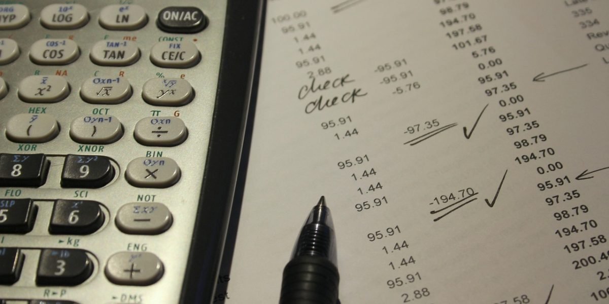 A person calmly and efficiently uses financial software to track market data and make informed investment decisions.