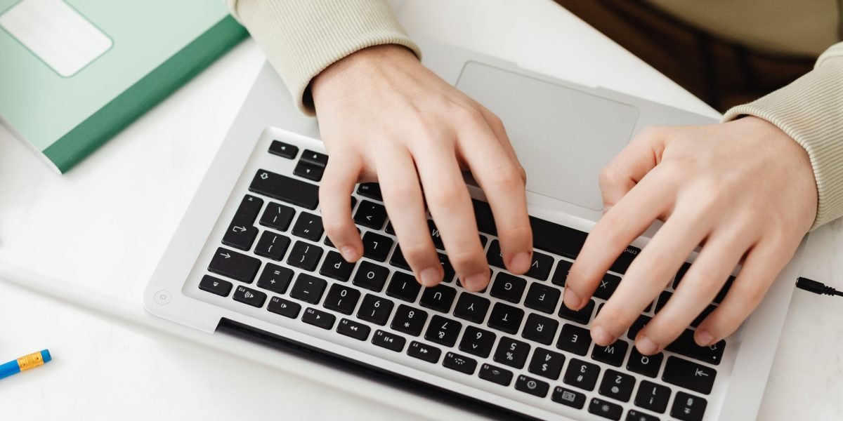 An individual engaged in online learning, representing the pursuit of new skills vital for adapting to AI's impact on work.