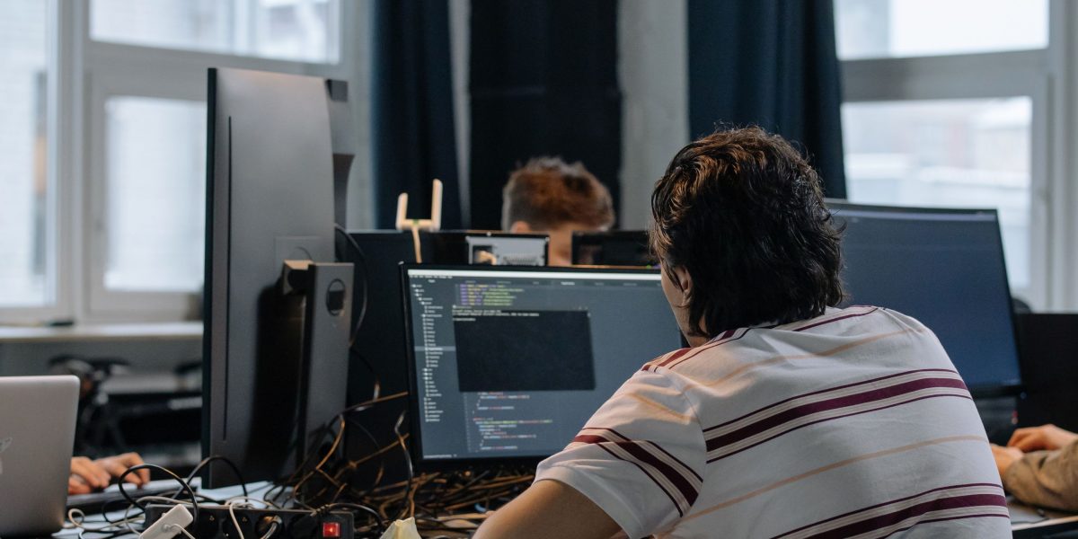 An early-stage AI startup team collaborates on initial product development, requiring strategic seed funding.