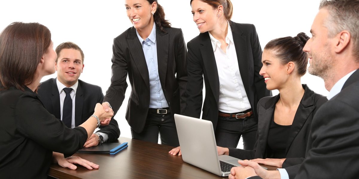 A team of professionals deliberates over regulatory guidelines and compliance issues for AI platform adoption.