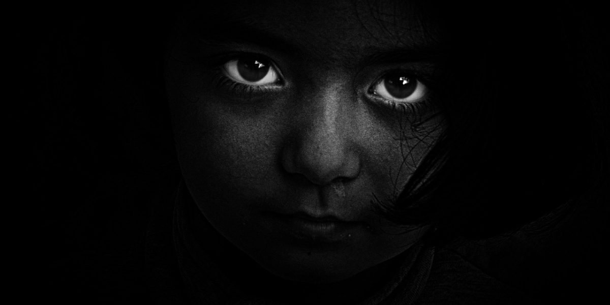 A person focused on researching information, symbolizing the quest for clear insights amidst overwhelming data.