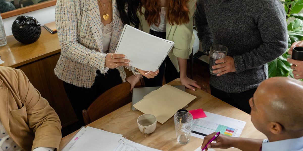 A team conducting thorough due diligence, meticulously examining documents and data for an AI investment.