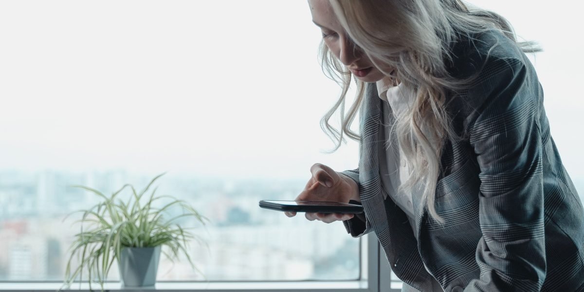 A business leader thoughtfully planning strategies in a modern office environment.