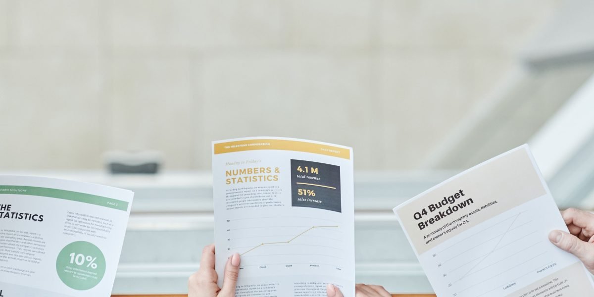 Business professionals reviewing financial reports, symbolizing the measurement of AI's ROI.