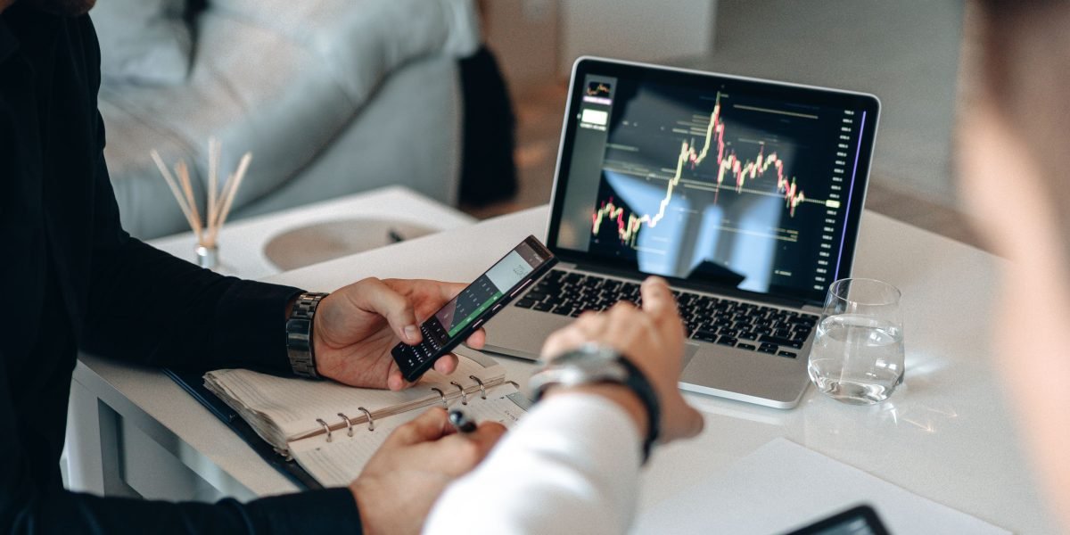 A business team in a collaborative setting, actively analyzing market data and identifying key trends.