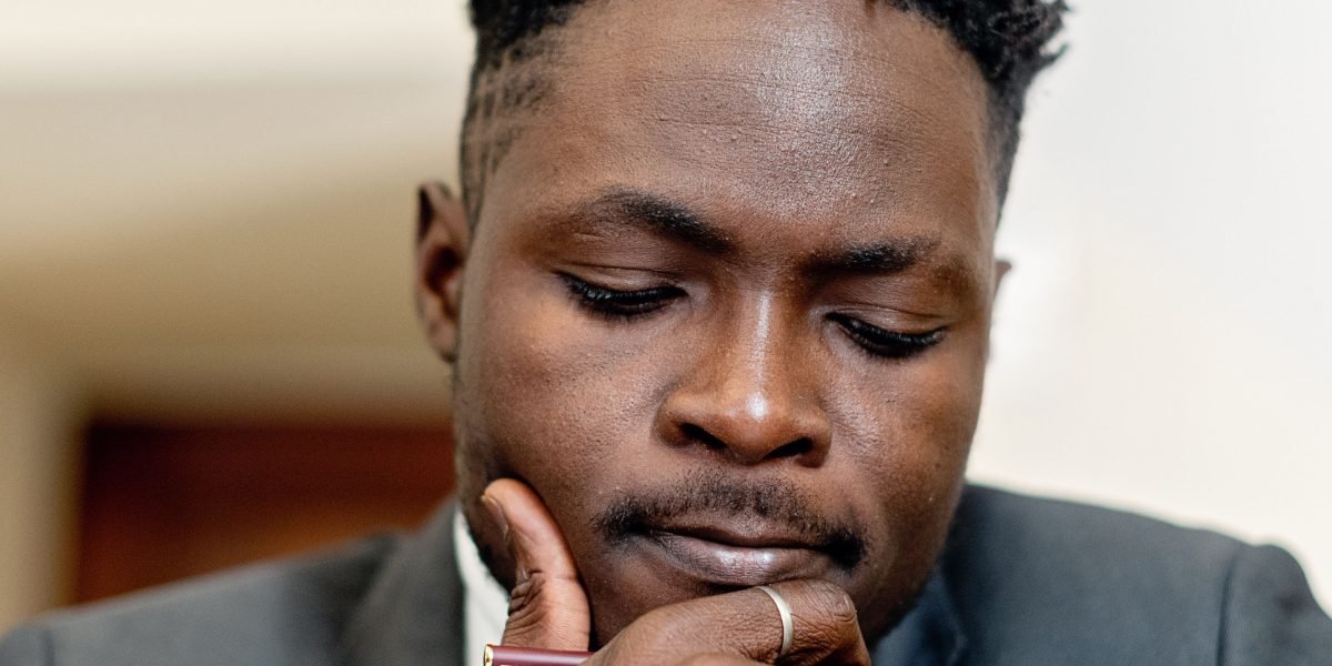 An executive contemplating complex market signals to make informed strategic decisions for their company.