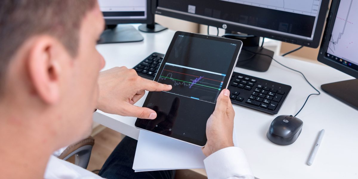 An investor studies various data points to make sense of a fast-moving market.