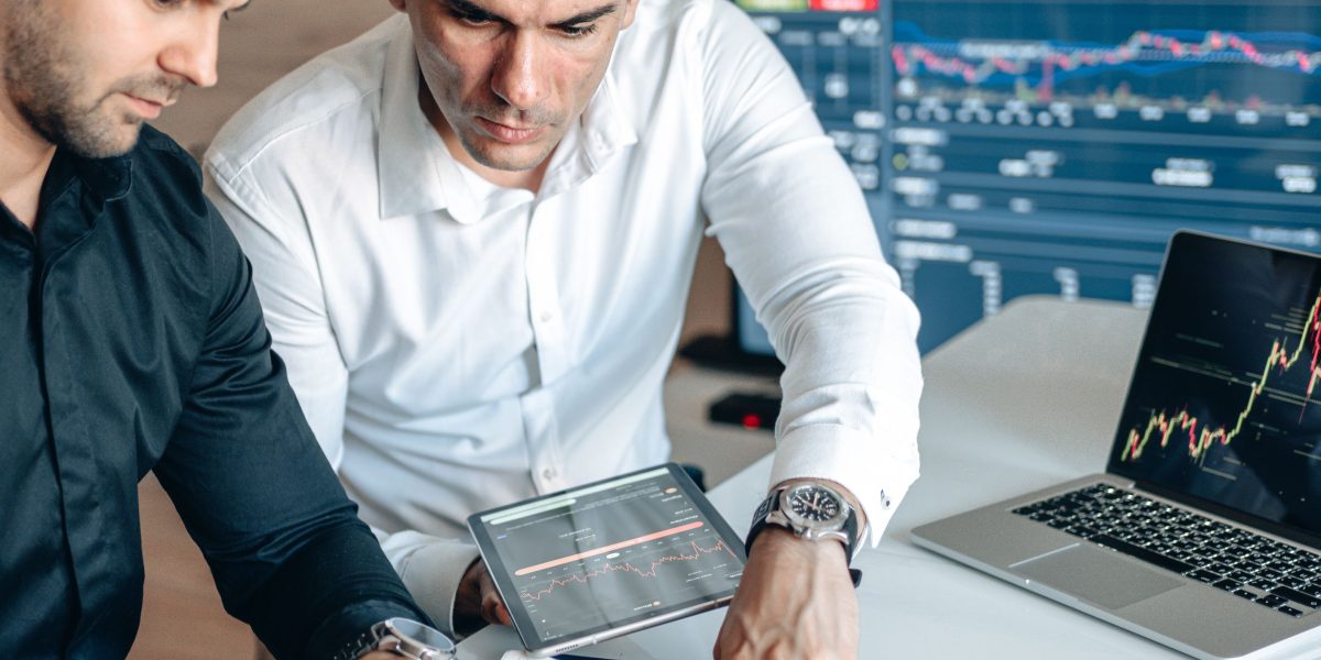 A team collaboratively reviewing data and discussing market insights, representing strategic analysis of funding signals in the AI healthcare sector.