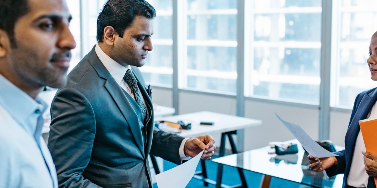 Executives engaged in a serious discussion, likely addressing ethical considerations and governance for AI implementation.